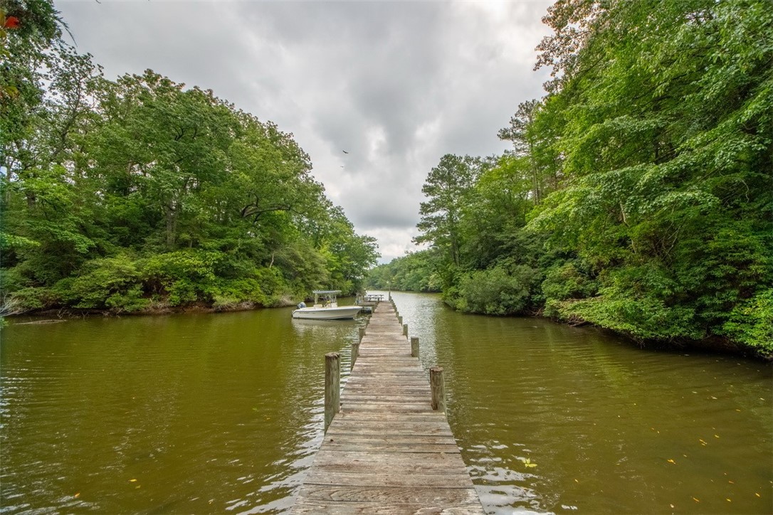 846 Twiggs Ferry Road Hartfield, VA 23071 - Photo 25 of 28 Dock featuring a water view and a view of trees