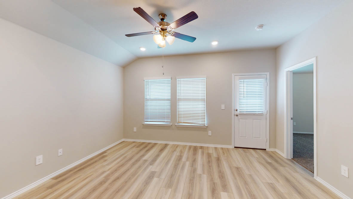 561 Hector Loop Georgetown, TX 78626 - Photo 11 of 30 wooden floor in an empty room with a window
