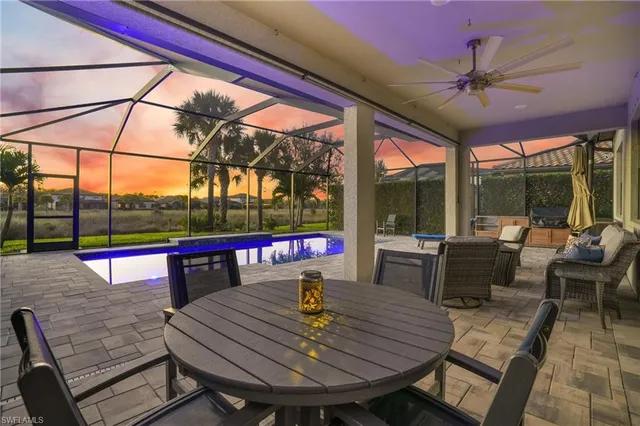 a view of a living room with furniture and window