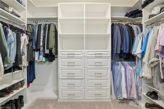 a living room with furniture and a book shelf