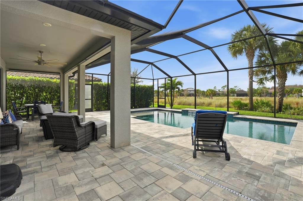 19906 Beverly Park Road Estero, FL 33928 - Photo 42 of 50 a building outdoor space with seating