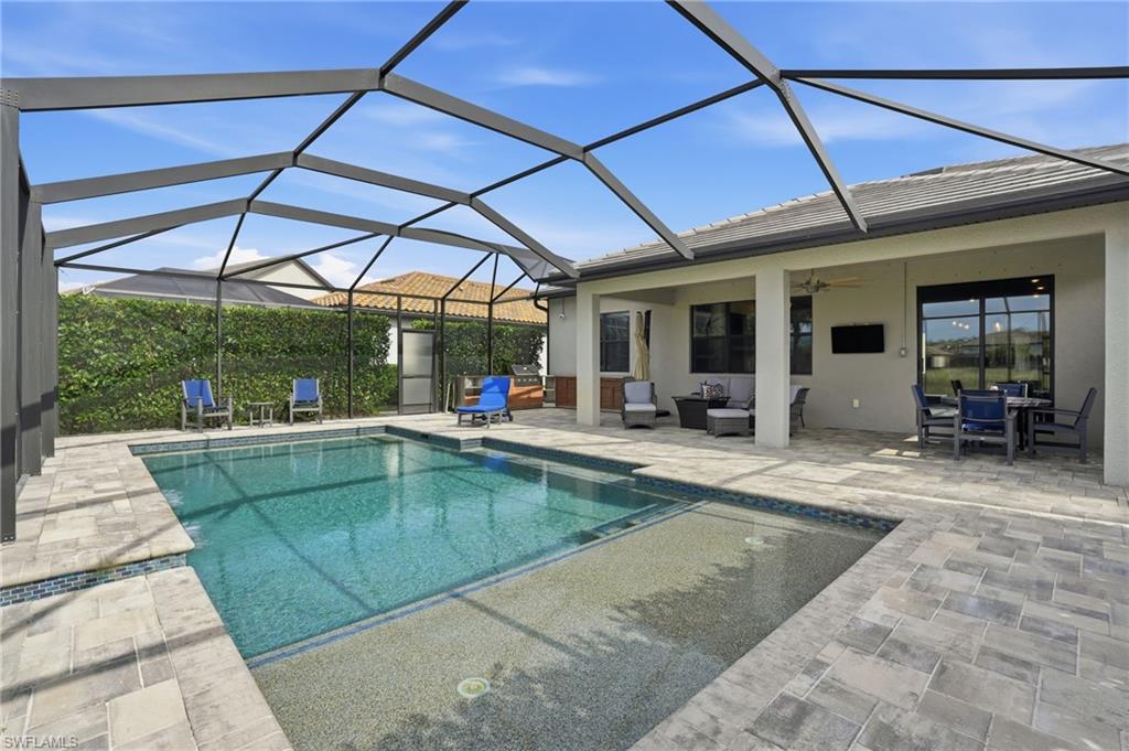 19906 Beverly Park Road Estero, FL 33928 - Photo 45 of 50 a view of a backyard patio and swimming pool