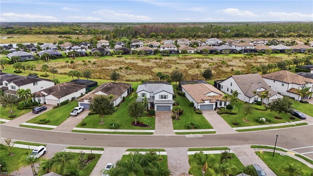 19906 Beverly Park Road Estero, FL 33928 - Photo 9 of 50 an aerial view of residential houses with outdoor space