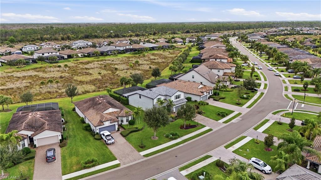 19906 Beverly Park Road Estero, FL 33928 - Photo 10 of 50 an aerial view of residential houses with outdoor space