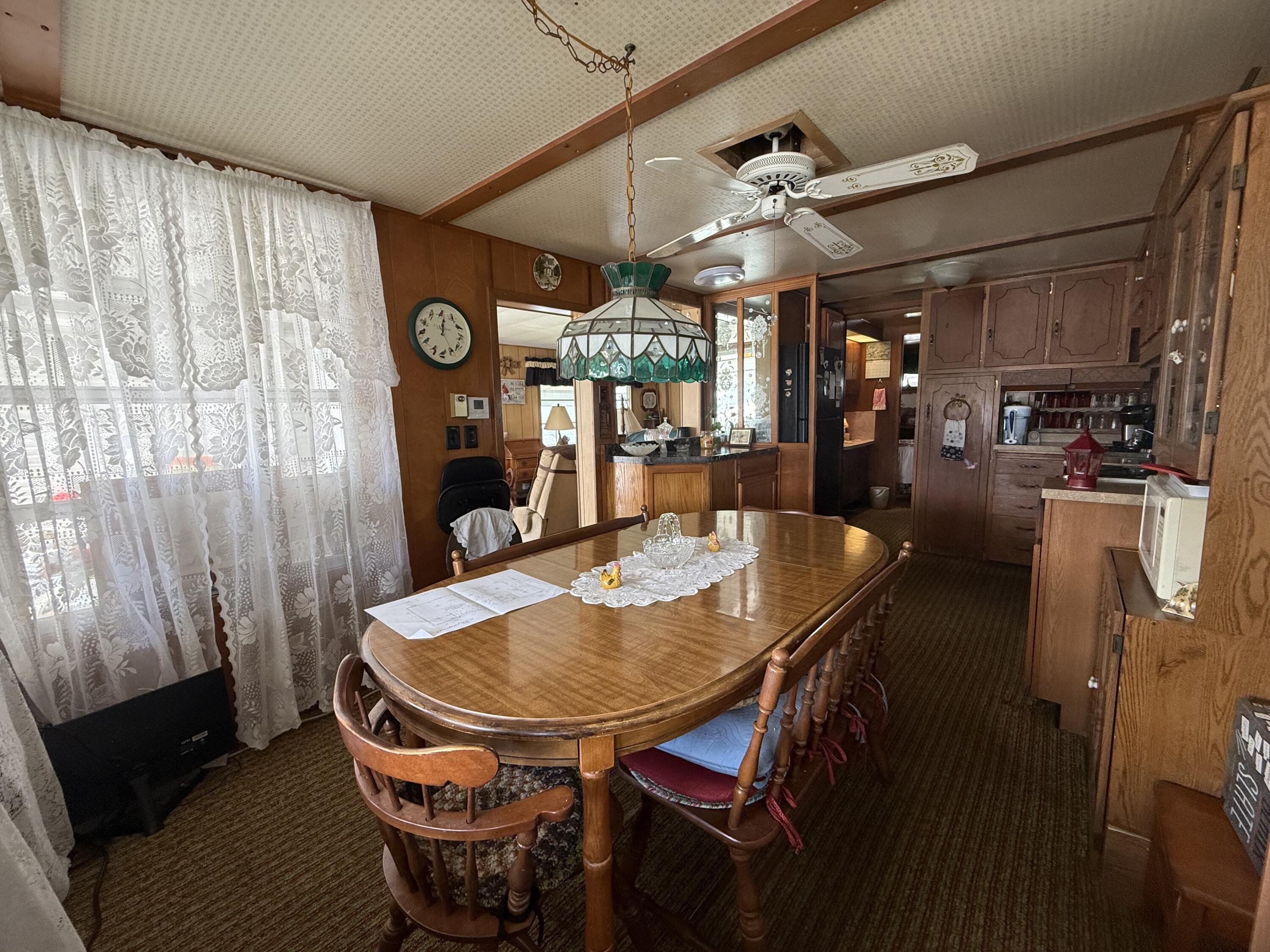 203 South Ibis Drive, Unit R Briny Breezes, FL 33435 - Photo 13 of 24 a dining room with furniture and window