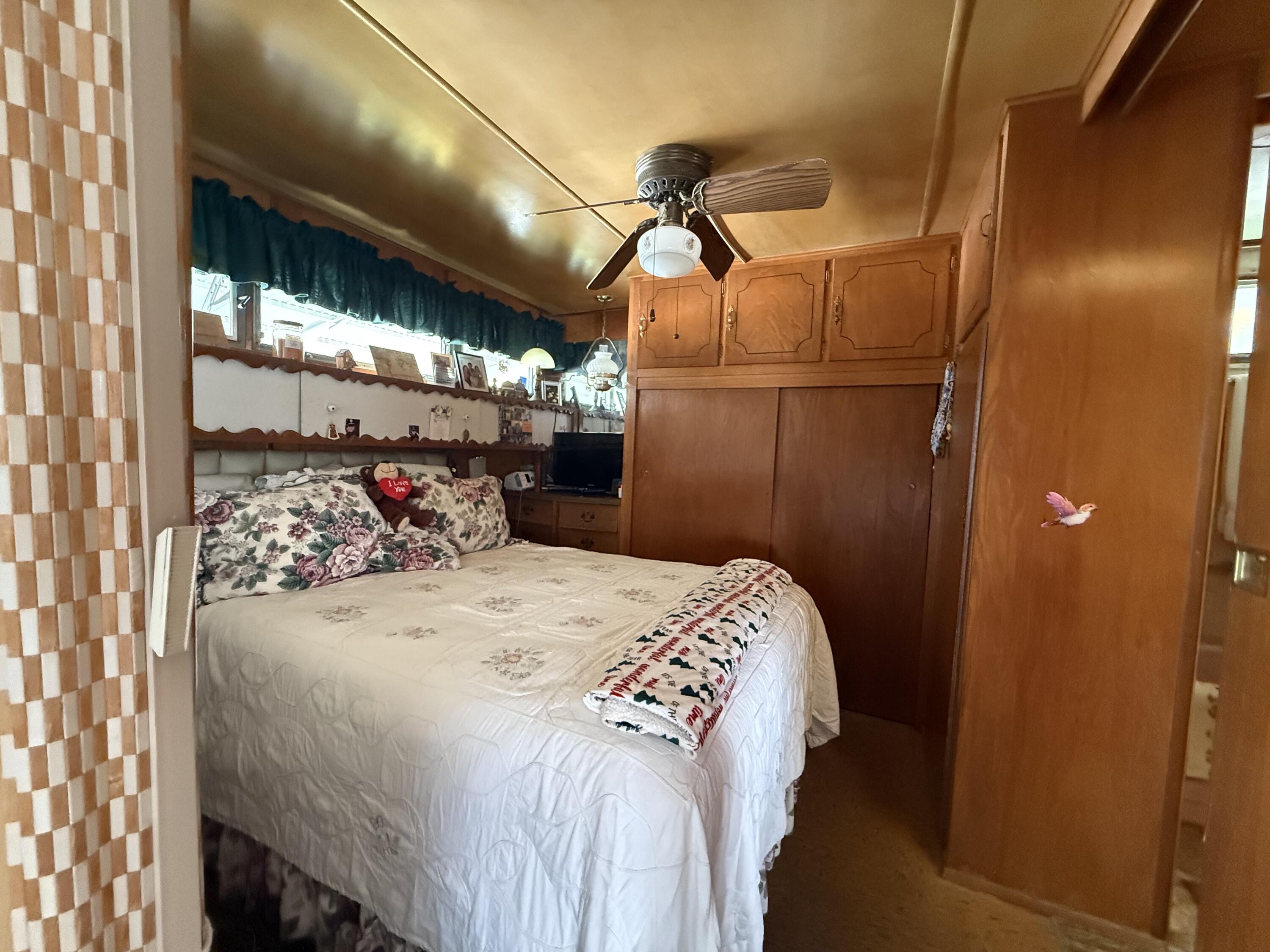 203 South Ibis Drive, Unit R Briny Breezes, FL 33435 - Photo 17 of 24 a bedroom with a bed and a window