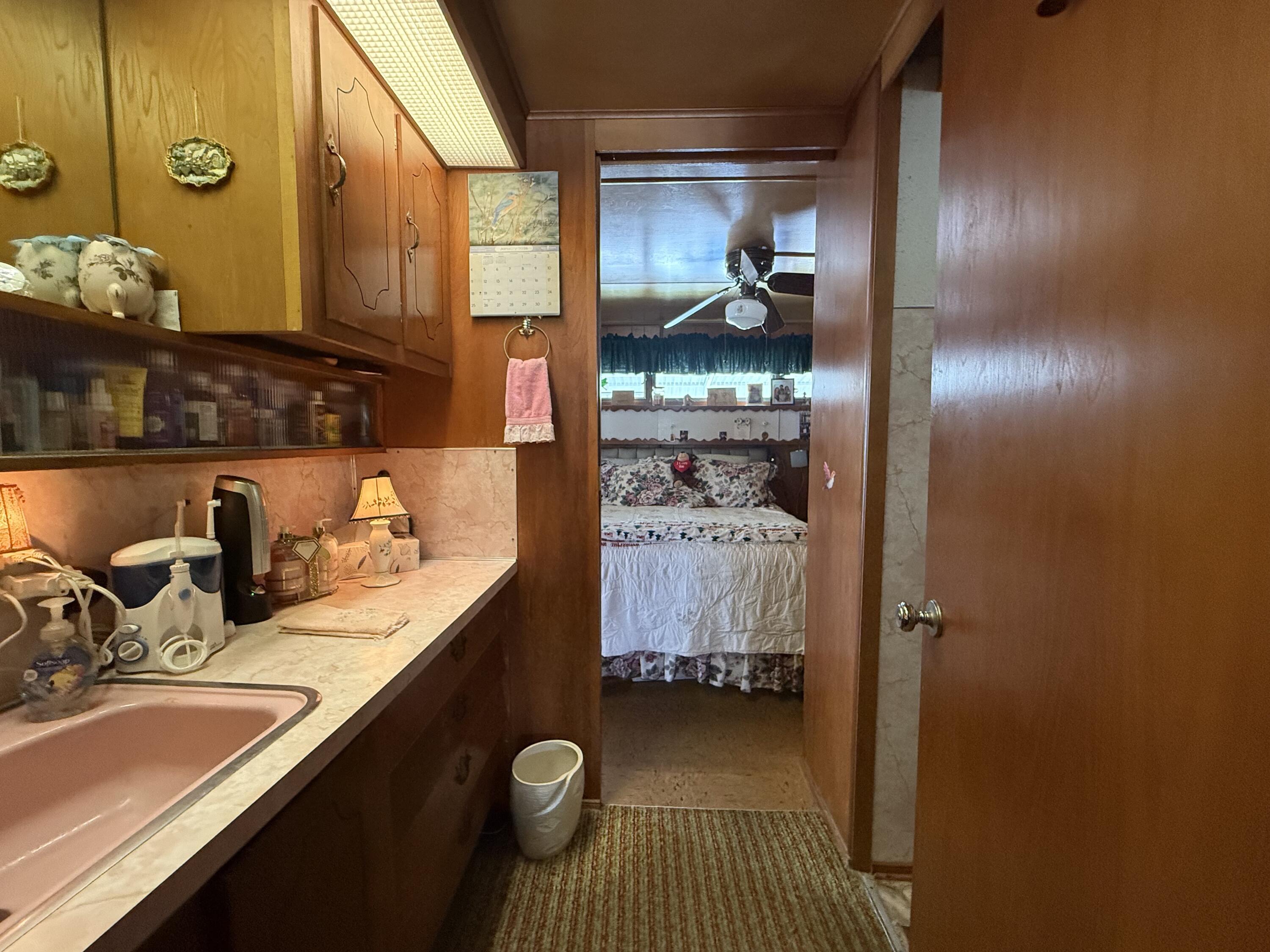 203 South Ibis Drive, Unit R Briny Breezes, FL 33435 - Photo 20 of 24 a bathroom with a sink and a mirror