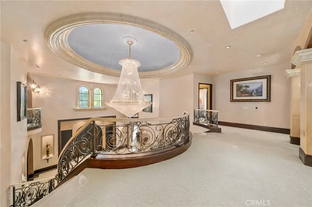 a spacious bathroom with a tub a double vanity sink a mirror a window and a shower