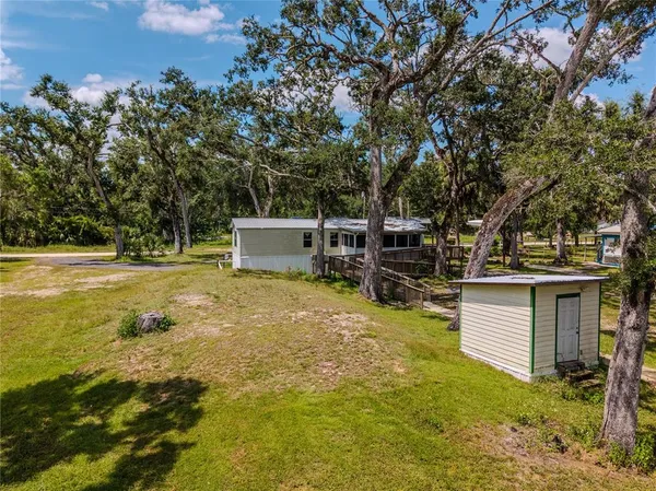a view of a room with wooden walls and iron stairs