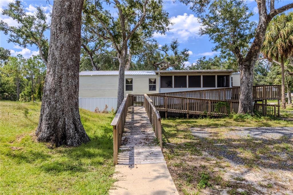 2008 River Road Steinhatchee, FL 32359 - Photo 22 of 41 a view of a house with a yard and large tree