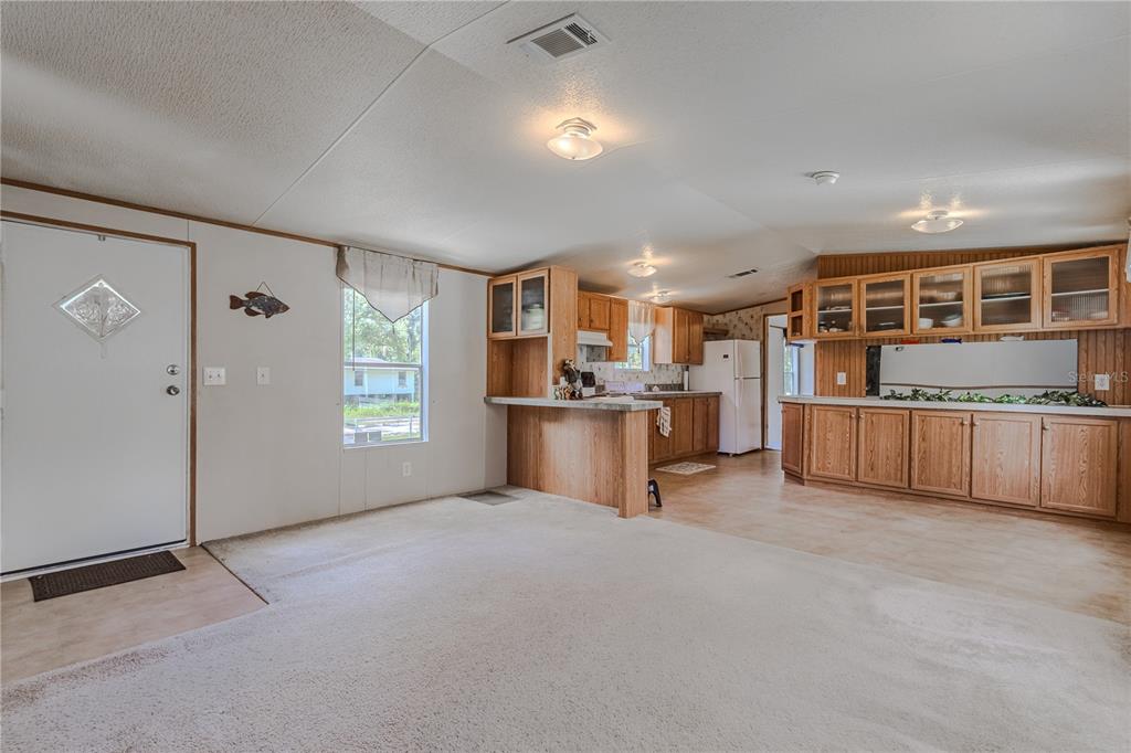 2008 River Road Steinhatchee, FL 32359 - Photo 34 of 41 a view of kitchen with refrigerator and window