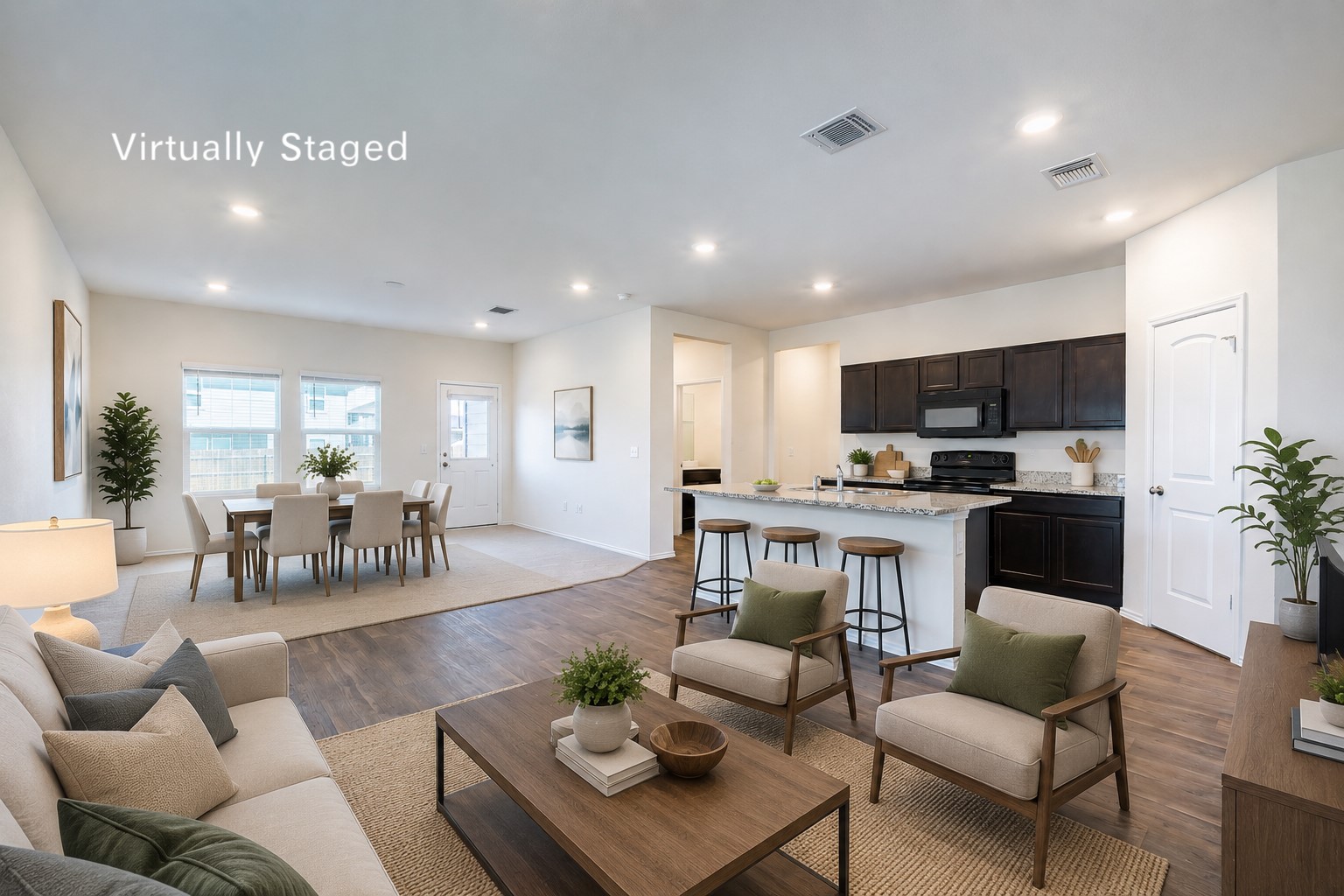 14917 Bajada Rd Manor Manor, TX 78653 - Photo 4 of 31 Open concept living space featuring wood-finish flooring, recessed lighting, and white walls