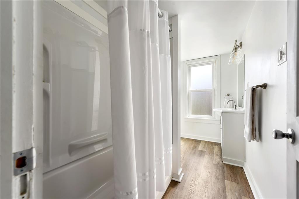 22 Millbridge Street Pittsburgh, PA 15210 - Photo 17 of 25 a view of a bathroom from a hallway