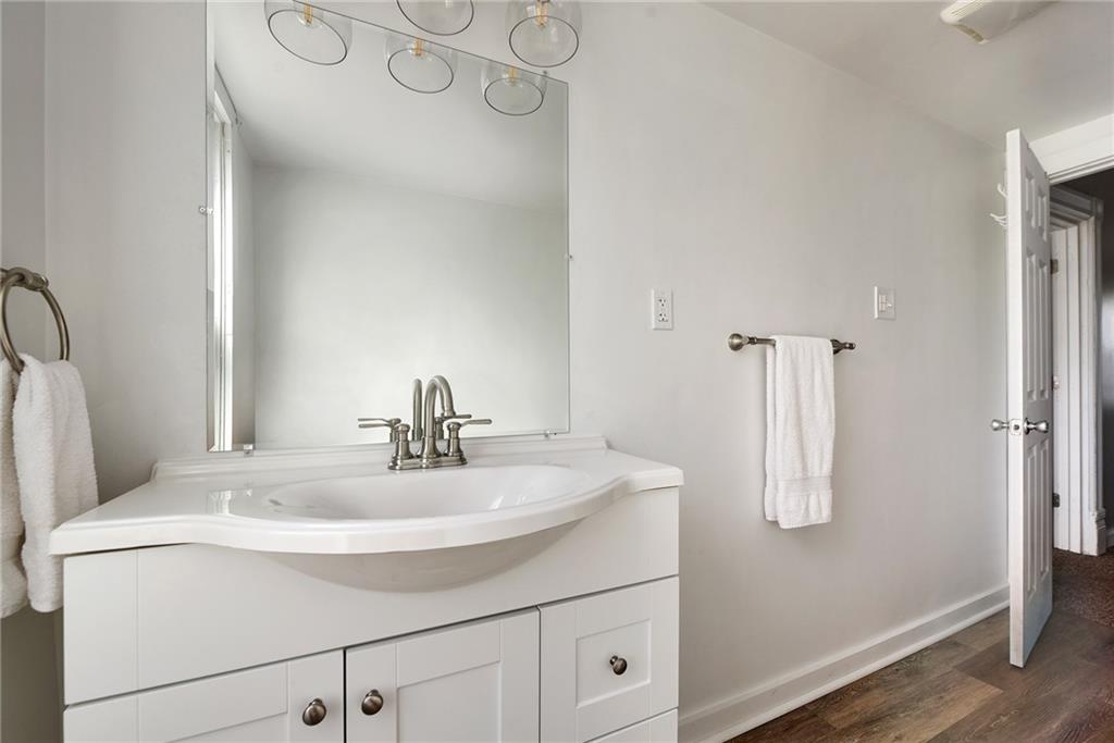 22 Millbridge Street Pittsburgh, PA 15210 - Photo 18 of 25 a bathroom with a sink and a mirror