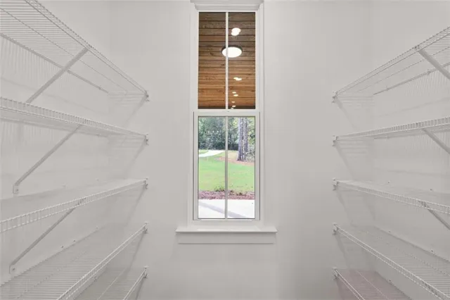 a living room with wooden floor and a fireplace