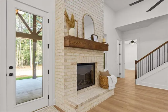 a view of kitchen with furniture and wooden floor