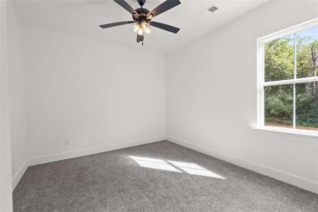 a spacious bathroom with a double vanity sink and a mirror