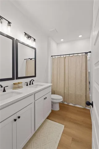 a view of an empty room with a ceiling fan