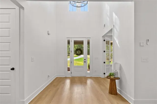 a large kitchen with cabinets wooden floor and a fireplace