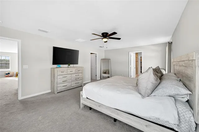 a bathroom with a sink vanity and mirror