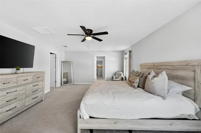 a bathroom with a double vanity sink a mirror and a bathtub