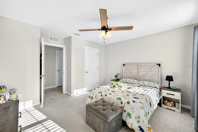 an aerial view of a residential building with outdoor space