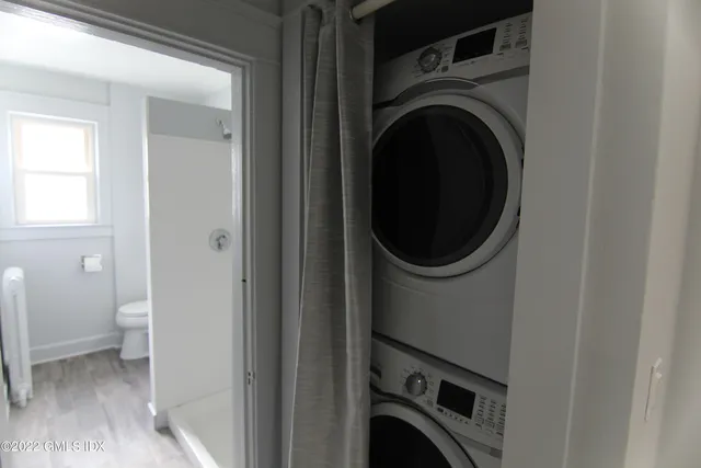 a close view of a utility room with dryer and washer
