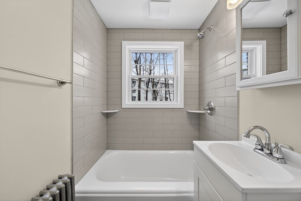 508 Cold Spring Avenue, Unit 1A West Springfield, MA 01089 - Photo 13 of 27 a white bath tub sitting next to a white sink