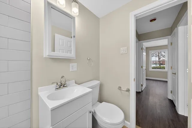 a bathroom with a sink toilet and vanity