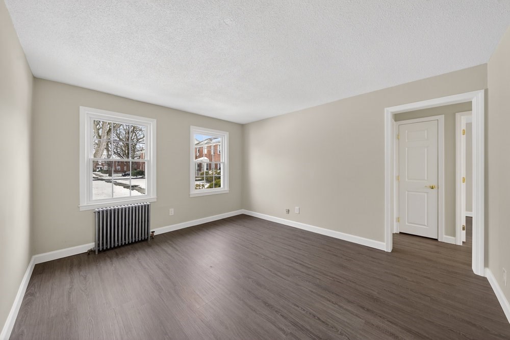 508 Cold Spring Avenue, Unit 1A West Springfield, MA 01089 - Photo 7 of 27 a view of an empty room with wooden floor and windows