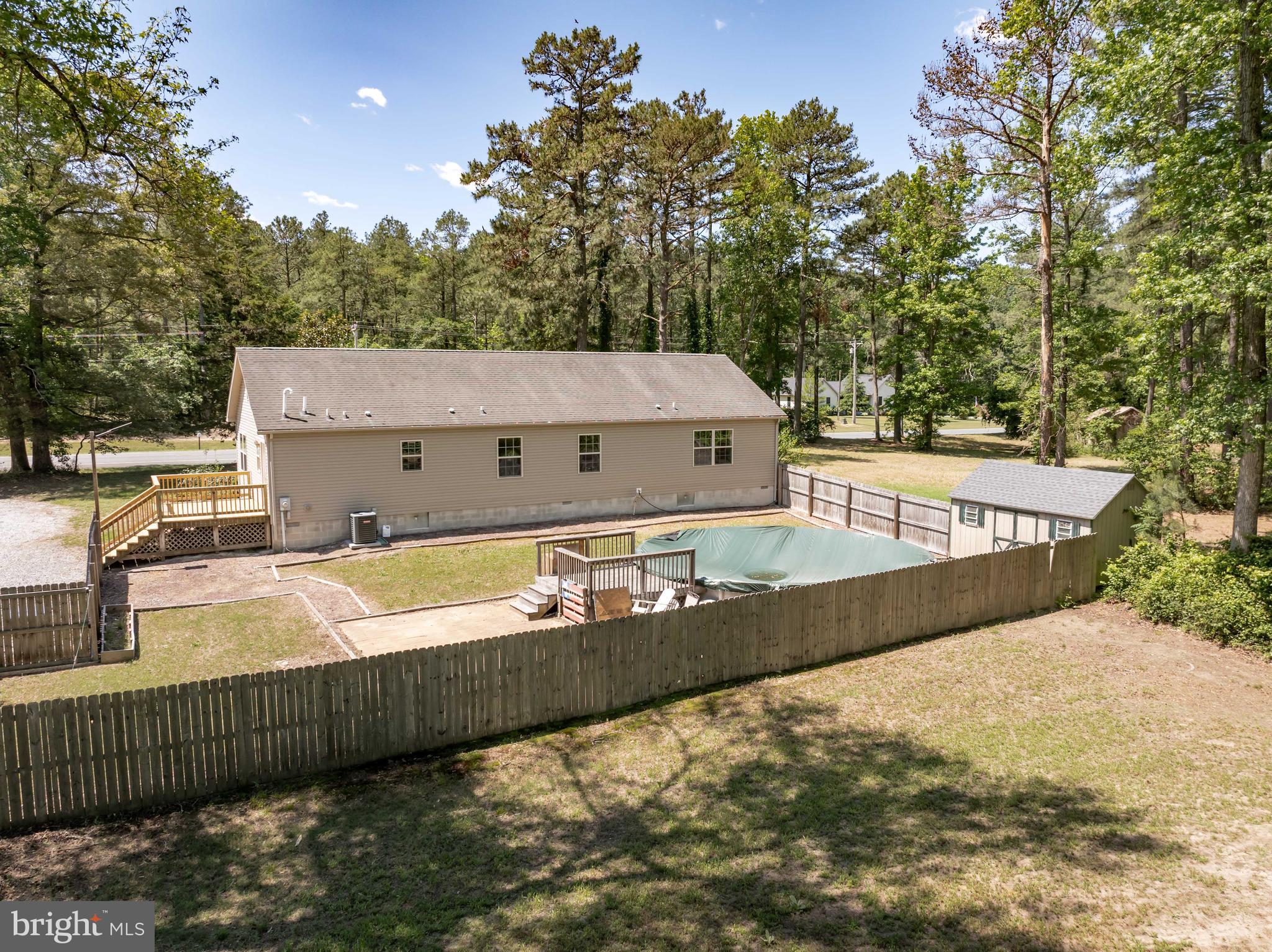6635 Libertytown Road Berlin, MD 21811 - Photo 57 of 88 a view of a swimming pool with a patio and wooden fence