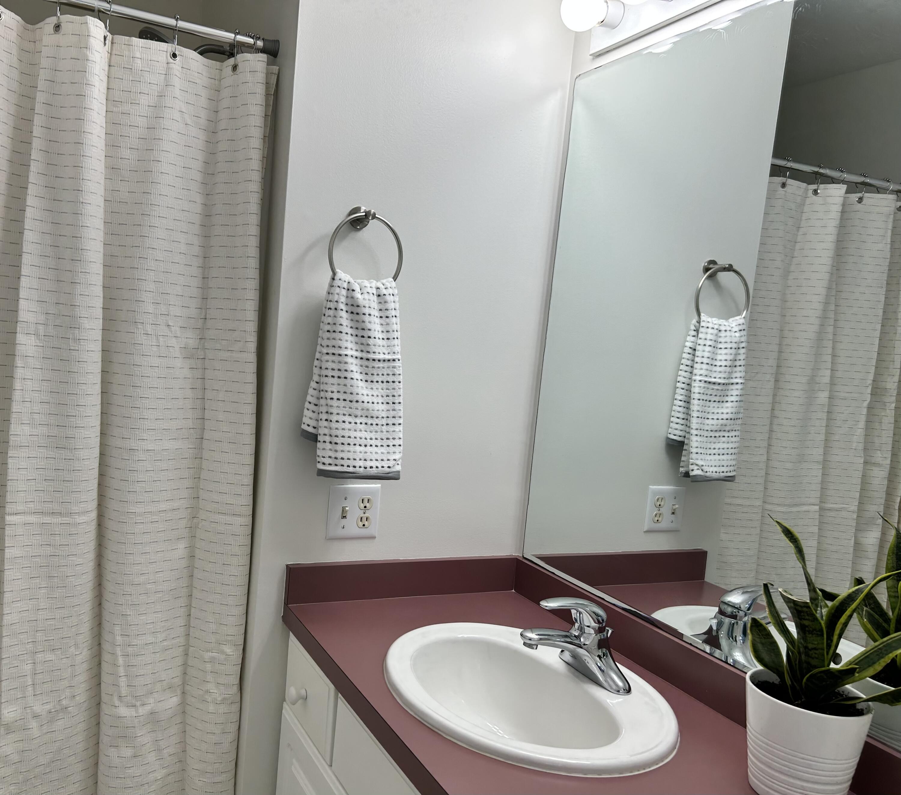 121 Old Post Road Centerville, MA 02632 - Photo 17 of 39 a bathroom with a sink a mirror <pad> and toilet