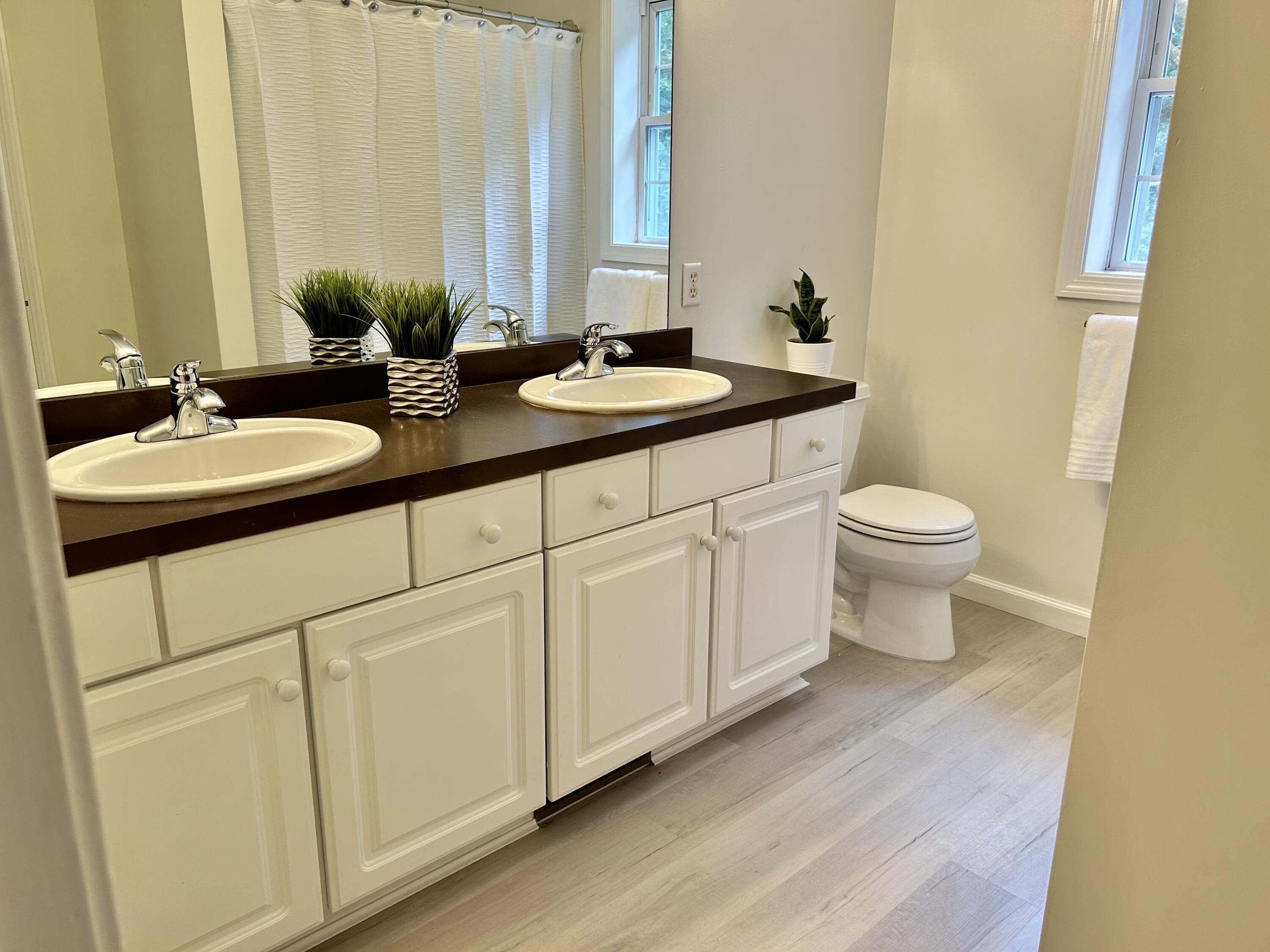 121 Old Post Road Centerville, MA 02632 - Photo 21 of 39 a bathroom with a sink and a mirror