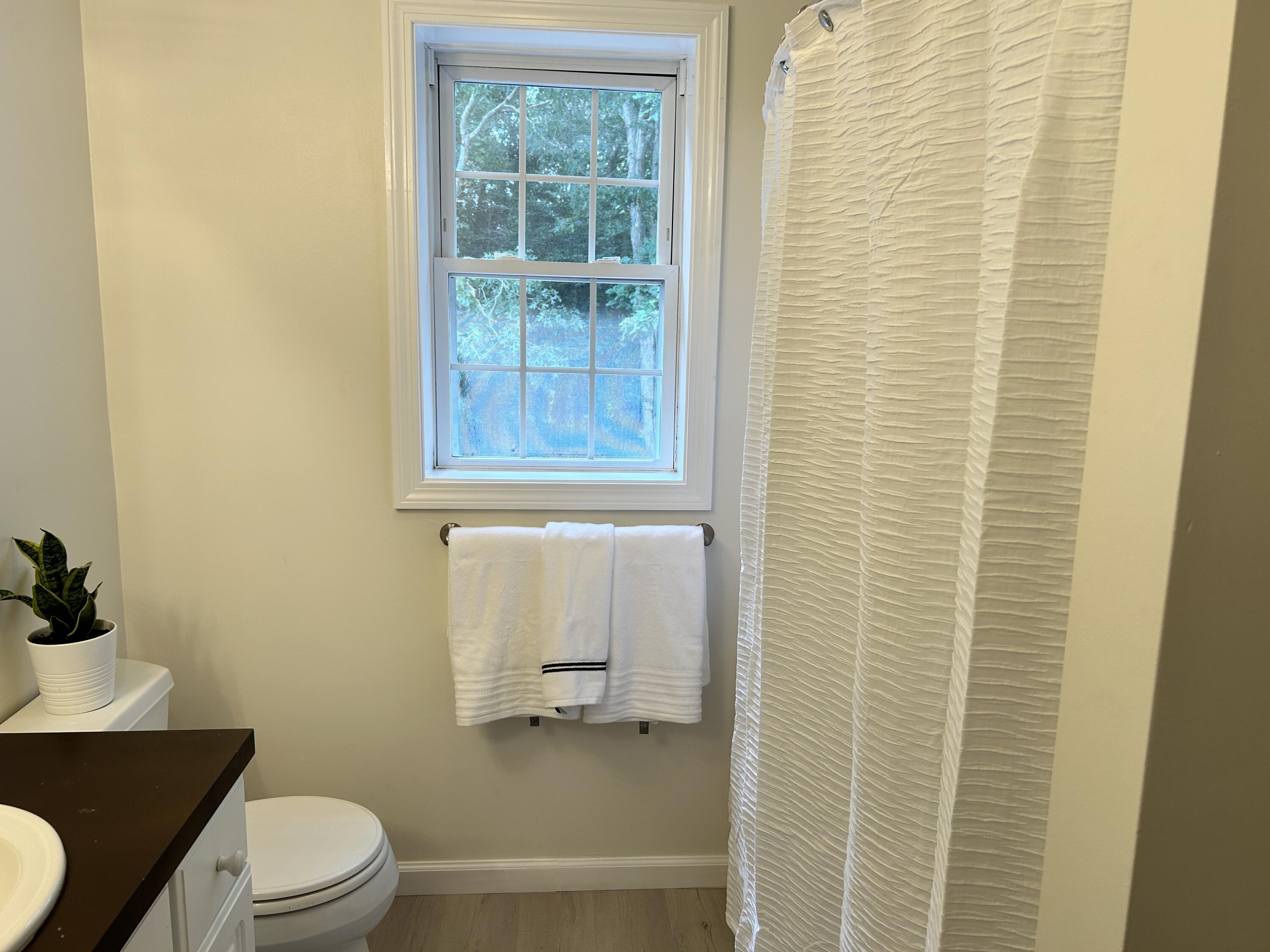 121 Old Post Road Centerville, MA 02632 - Photo 22 of 39 a bathroom with a toilet a sink and a shower