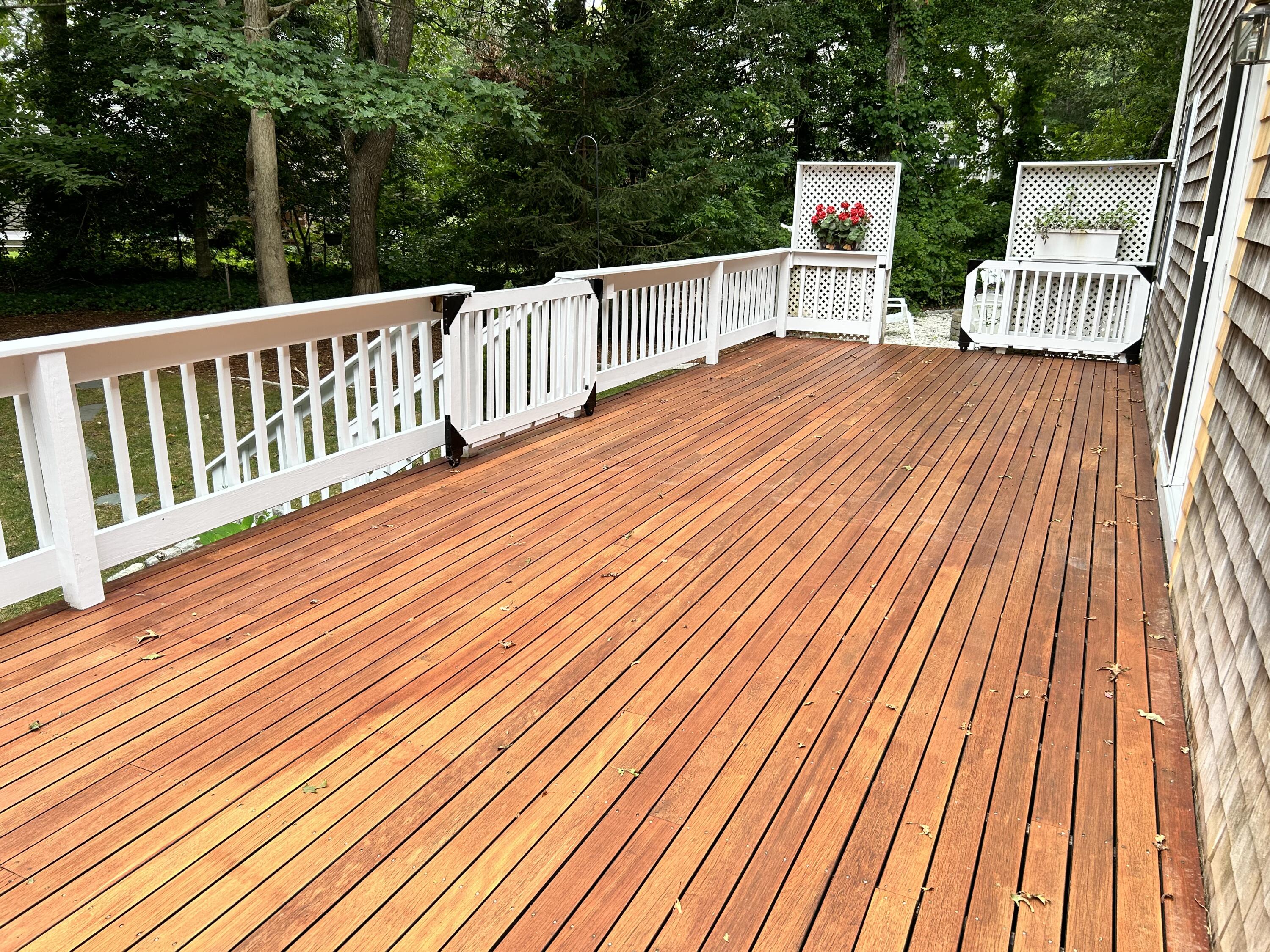 121 Old Post Road Centerville, MA 02632 - Photo 27 of 39 a balcony with wooden floor and fence