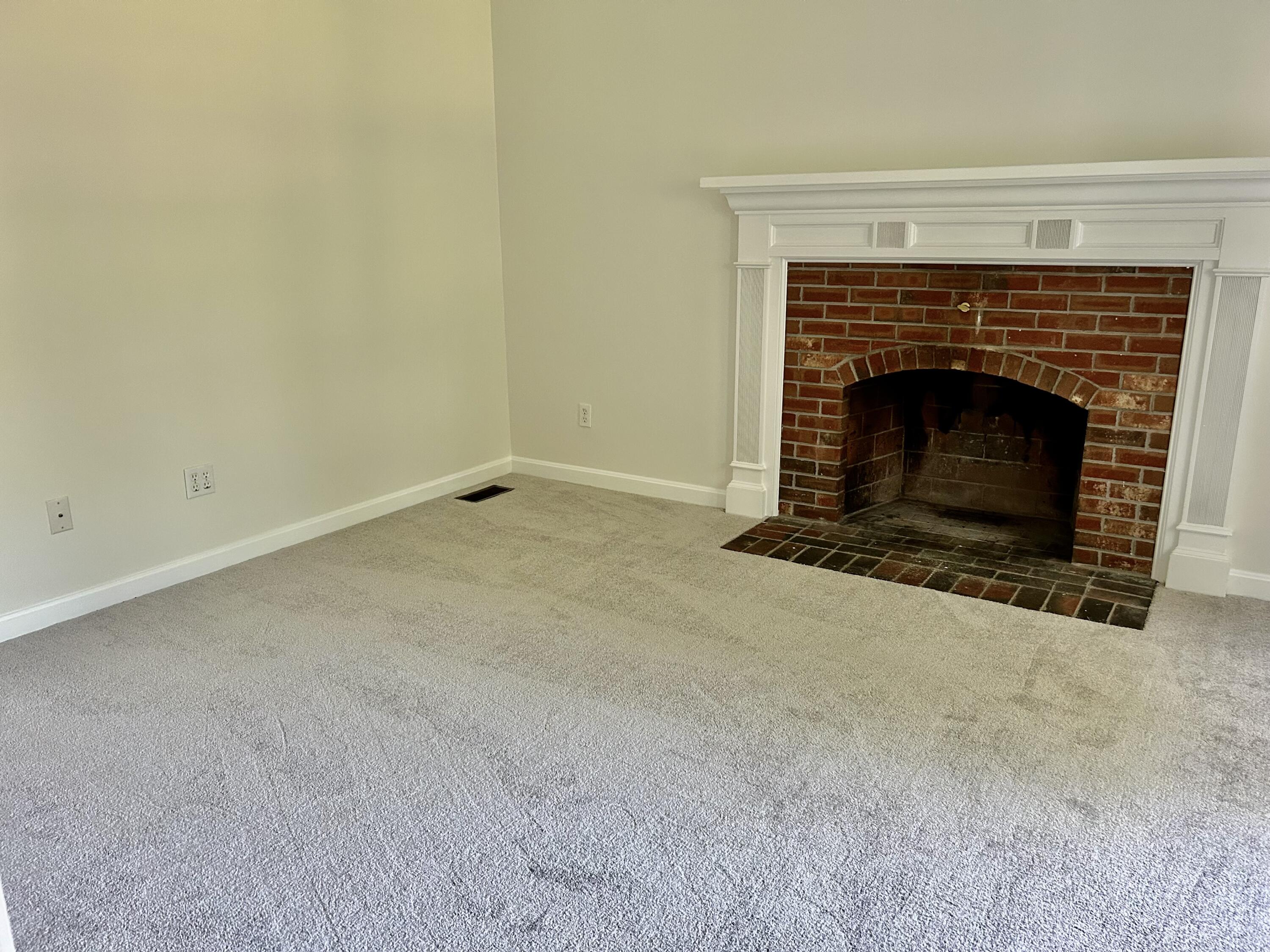 121 Old Post Road Centerville, MA 02632 - Photo 8 of 39 a view of empty room with a fireplace