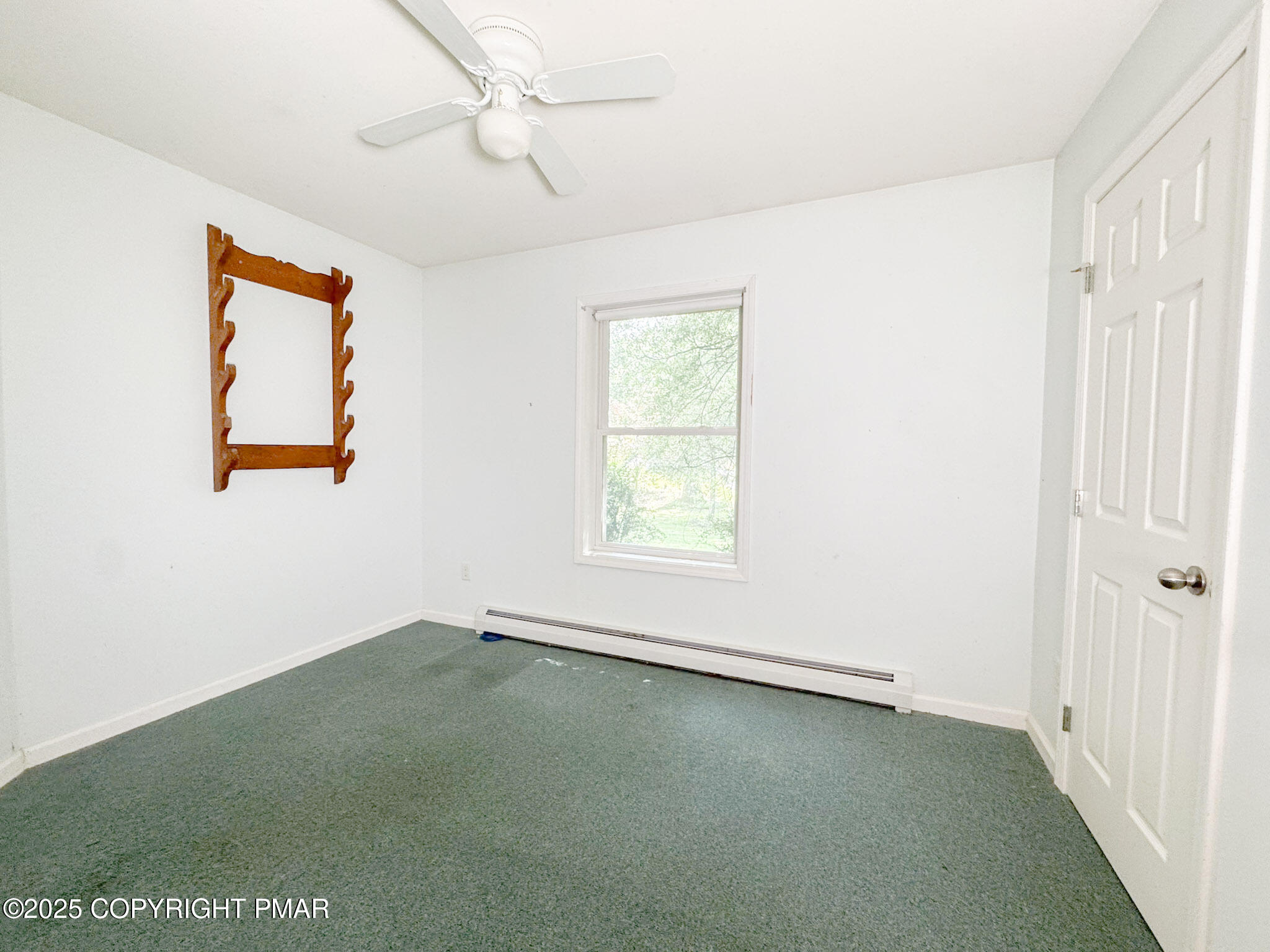 111 Turkey Ridge Drive Kunkletown, PA 18058 - Photo 17 of 30 an empty room with a window and a ceiling fan