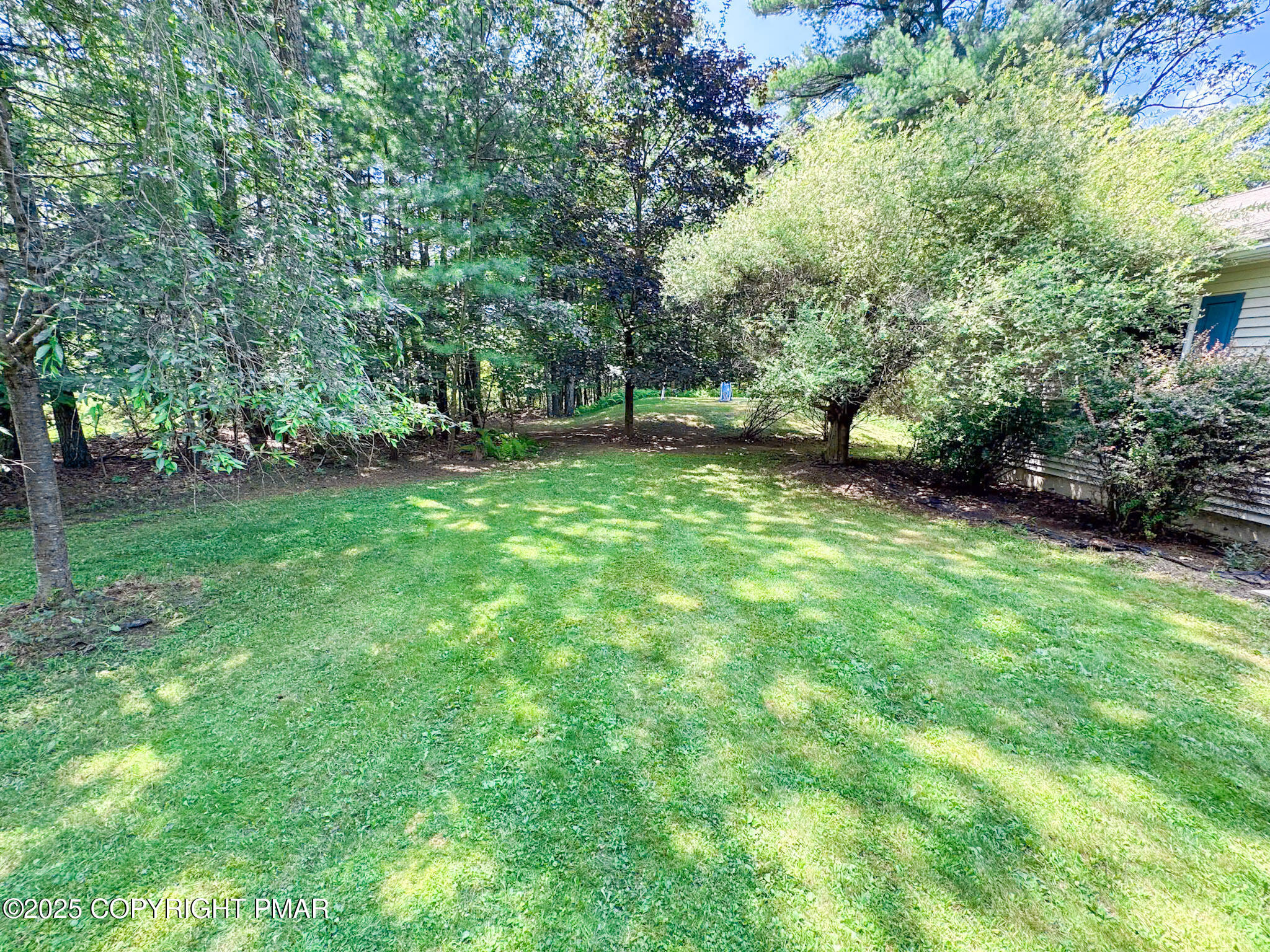 111 Turkey Ridge Drive Kunkletown, PA 18058 - Photo 26 of 30 a view of a backyard with a large tree