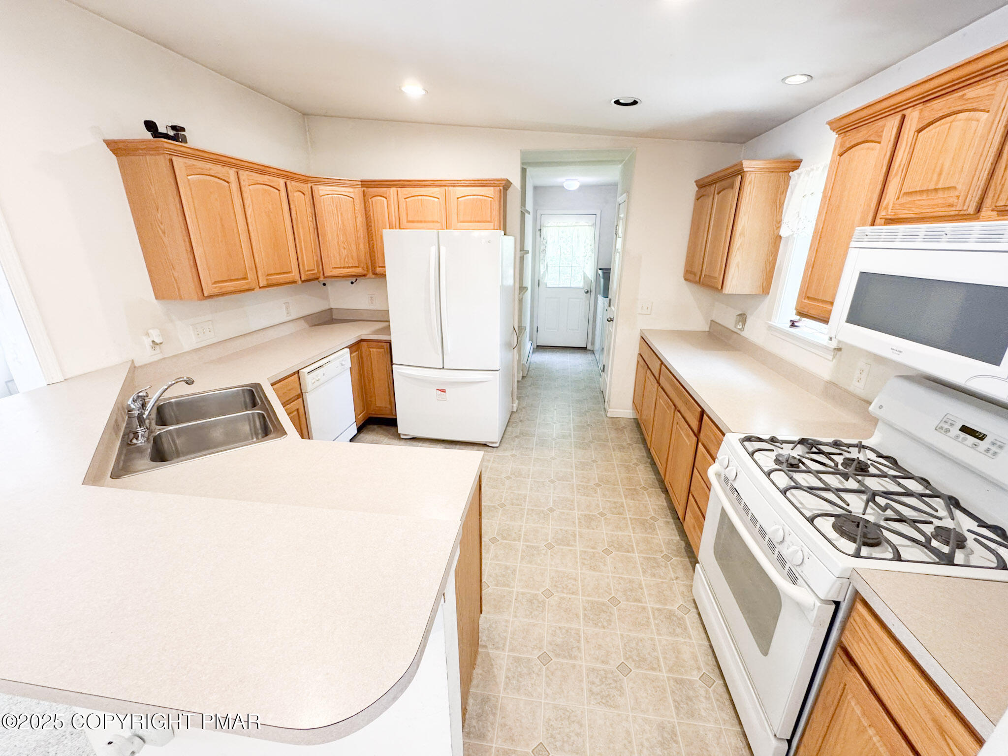 111 Turkey Ridge Drive Kunkletown, PA 18058 - Photo 5 of 30 a kitchen with a sink a stove and refrigerator