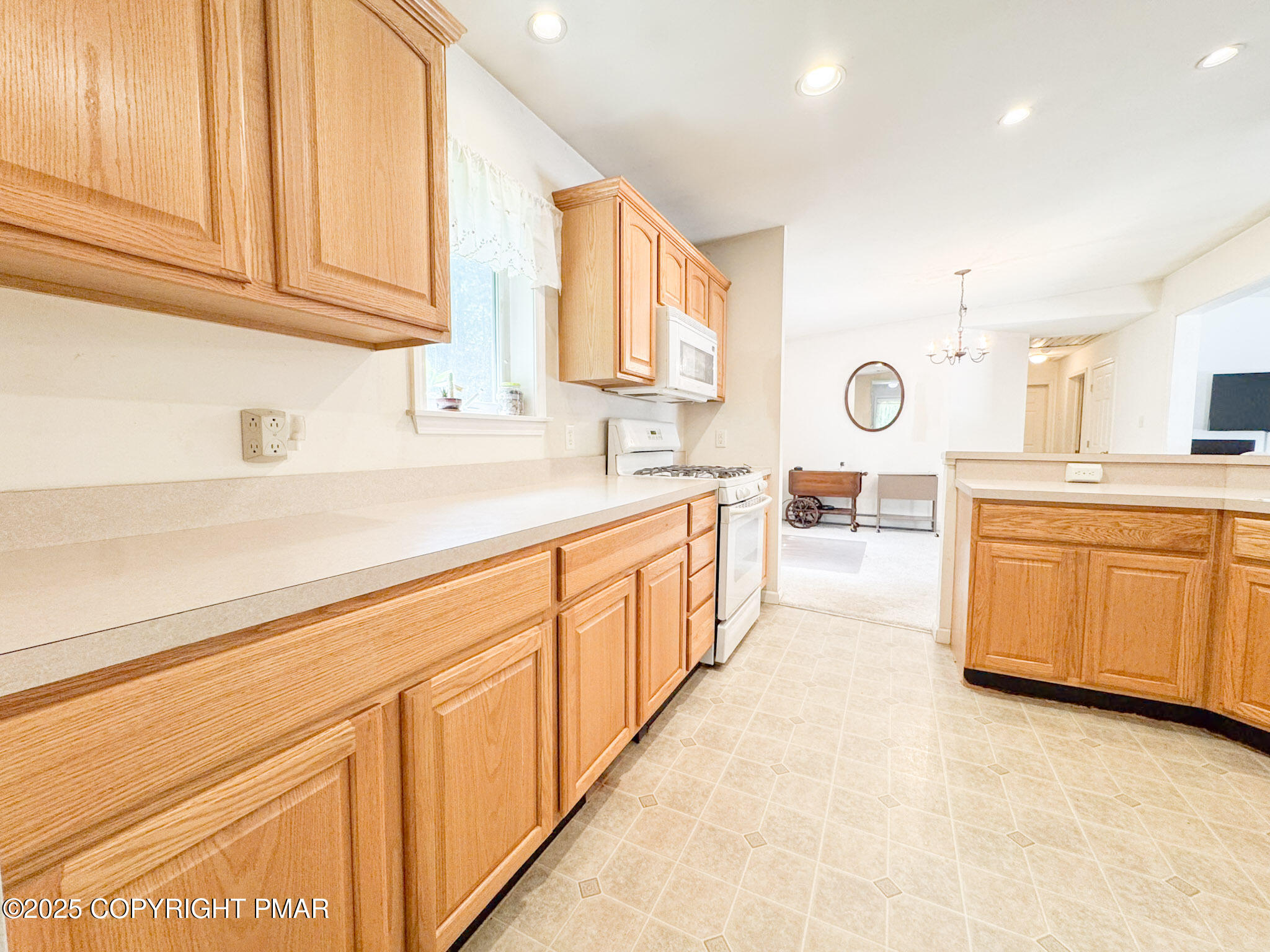 111 Turkey Ridge Drive Kunkletown, PA 18058 - Photo 7 of 30 a large white kitchen with a sink a dishwasher and cabinets with wooden floor