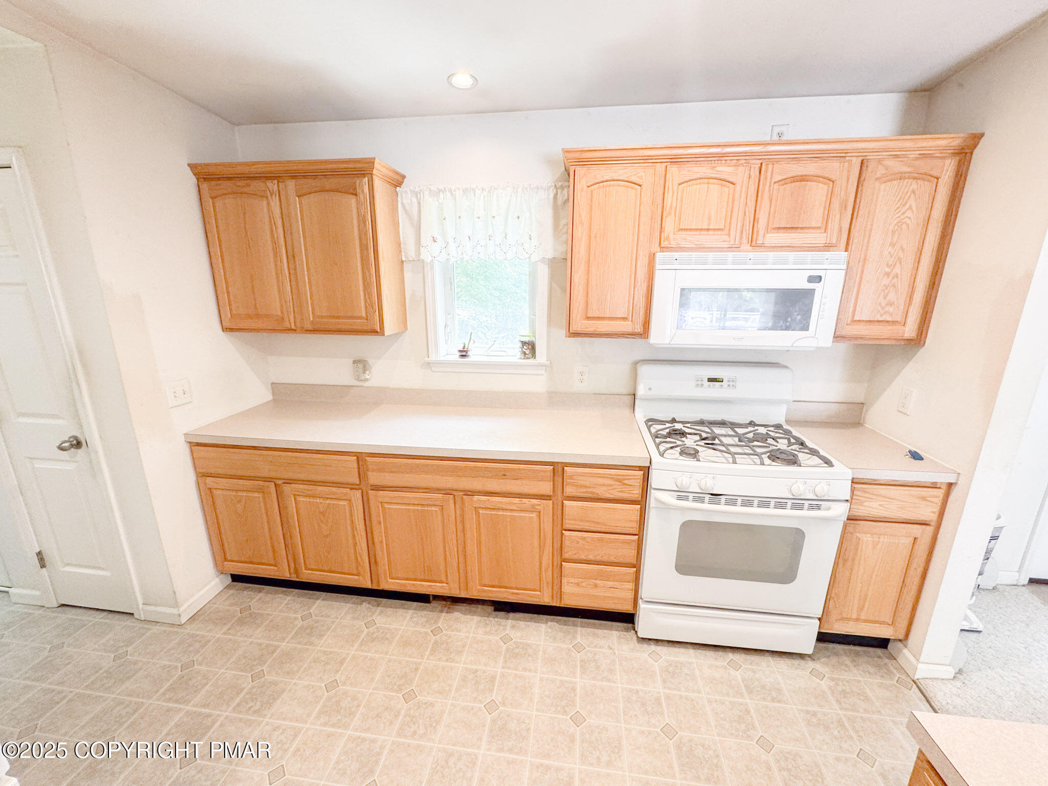 111 Turkey Ridge Drive Kunkletown, PA 18058 - Photo 9 of 30 a kitchen with granite countertop a sink and a stove top oven