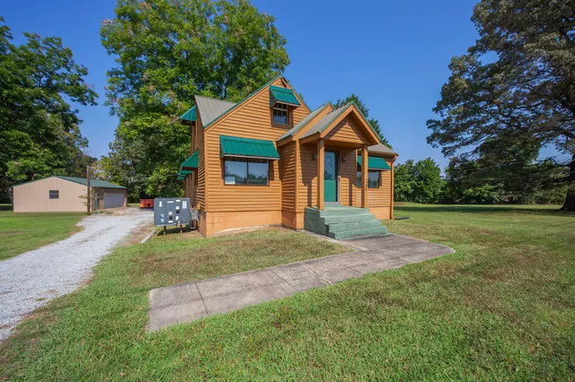 a front view of a house with a yard