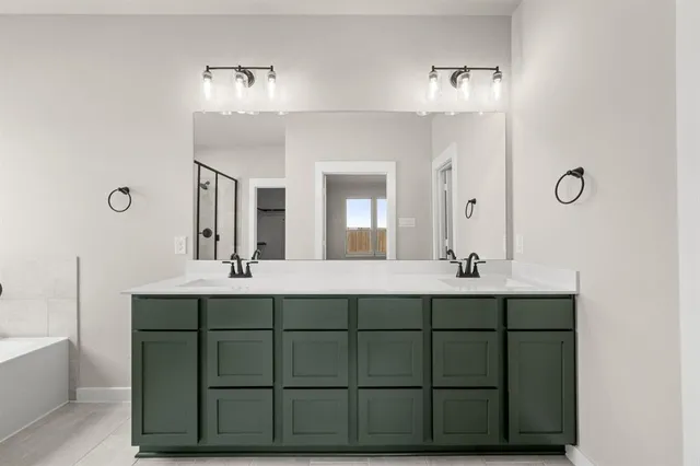 a bathroom with a bathtub and shower