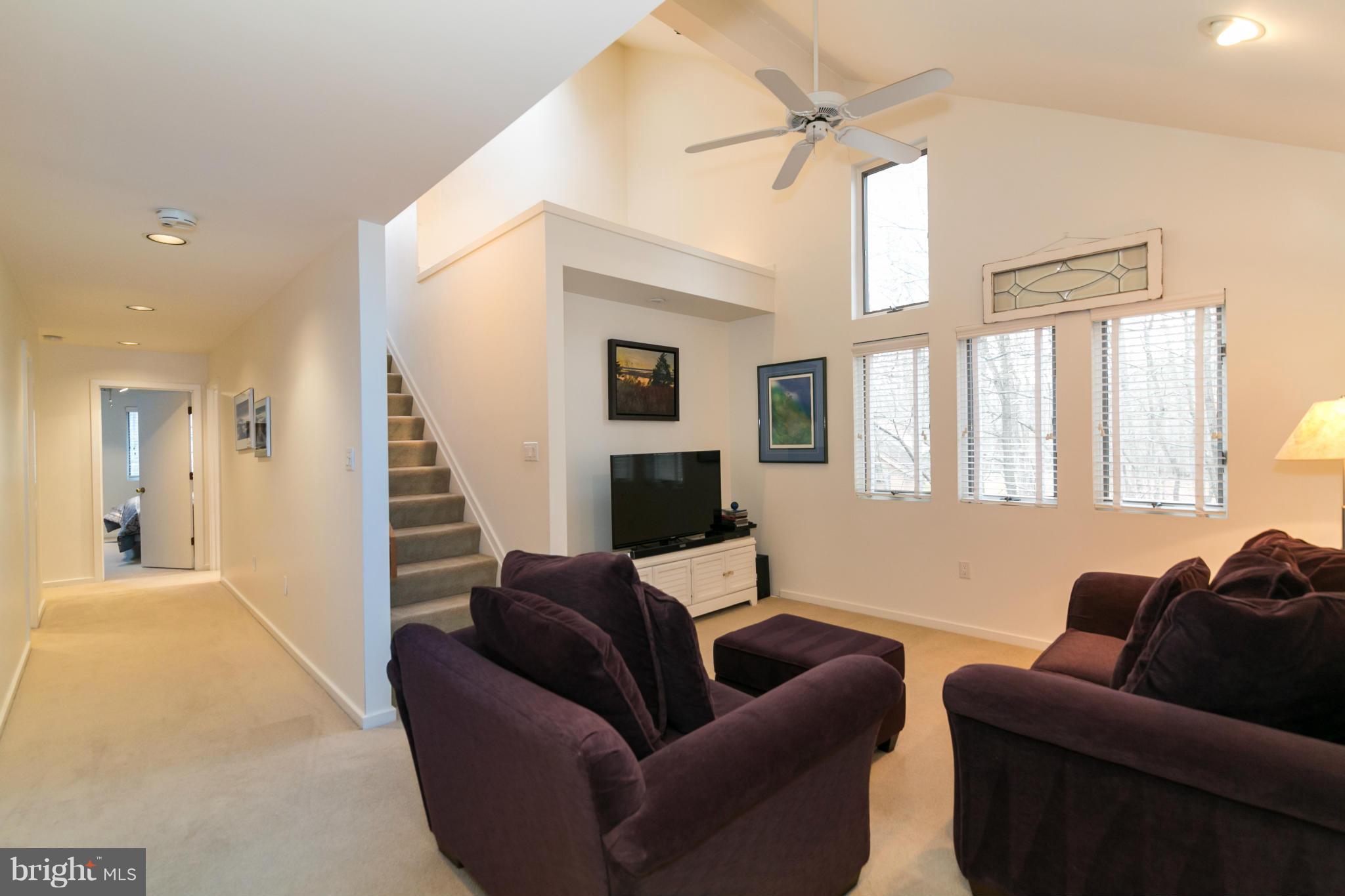 11915 State Rte 4707 Reston, VA 20191 - Photo 22 of 30 a living room with furniture and a flat screen tv