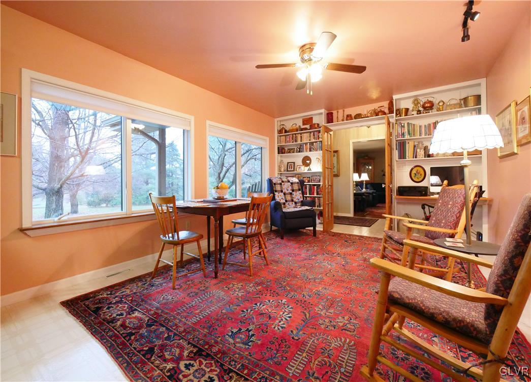 1043 Capp Road Nazareth, PA 18064 - Photo 16 of 41 a living room with furniture a dining table and large windows