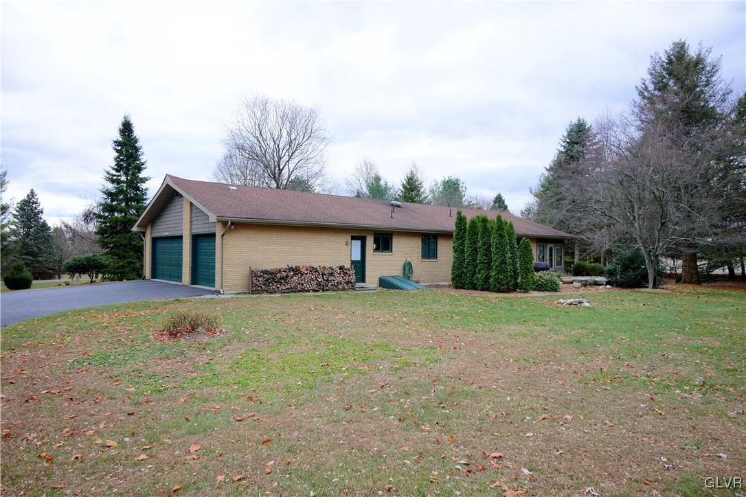 1043 Capp Road Nazareth, PA 18064 - Photo 5 of 41 a front view of house with yard and trees