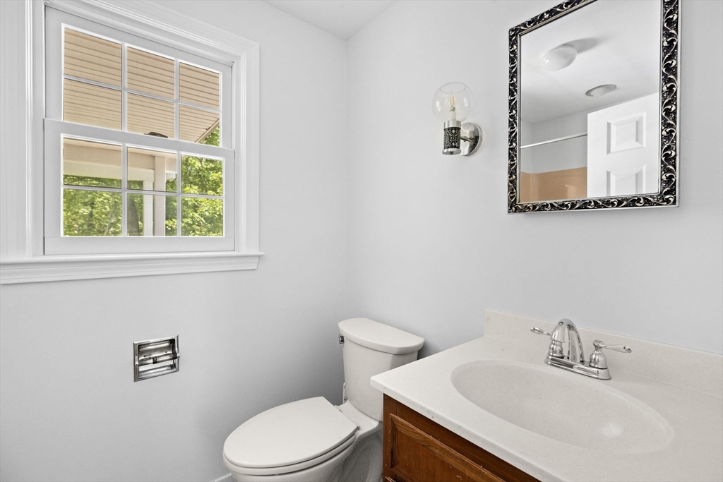 229 Edmands Road Framingham, MA 01701 - Photo 25 of 42 a bathroom with a sink a mirror and a toilet
