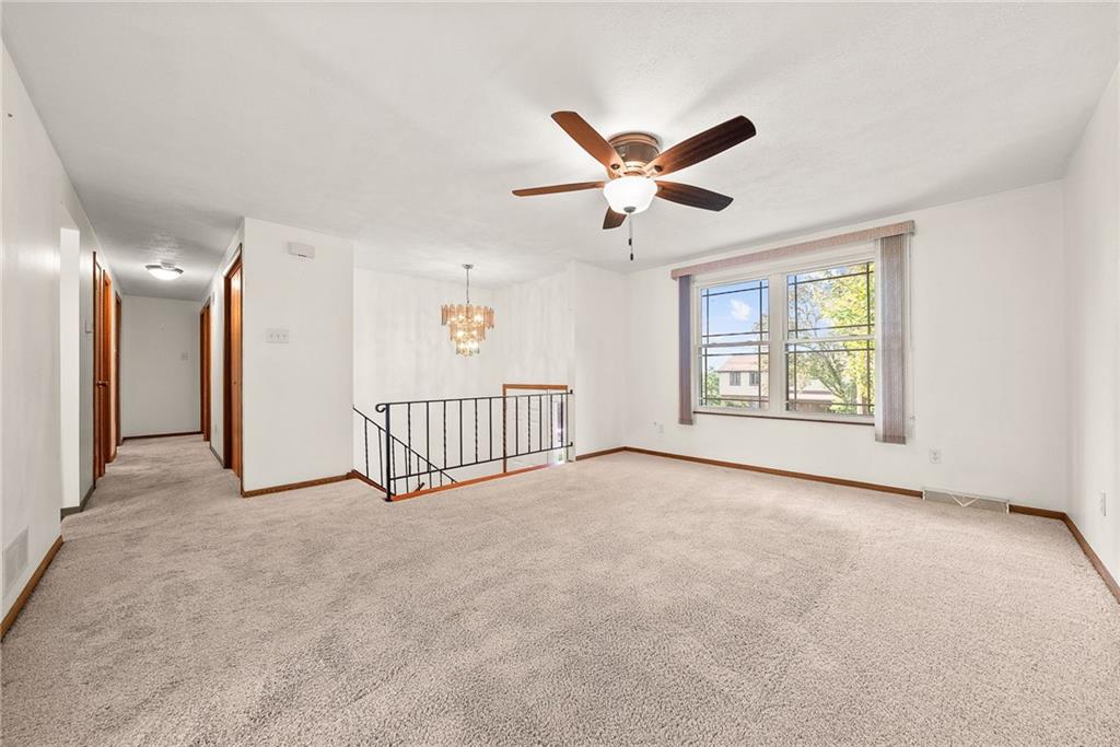 2775 Tischler Road Bethel Park, PA 15102 - Photo 3 of 33 an empty room with windows and ceiling fan