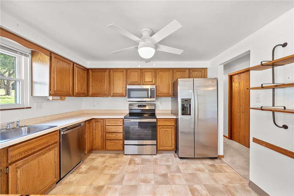 2775 Tischler Road Bethel Park, PA 15102 - Photo 7 of 33 a kitchen with stainless steel appliances granite countertop a refrigerator oven a sink and dishwasher