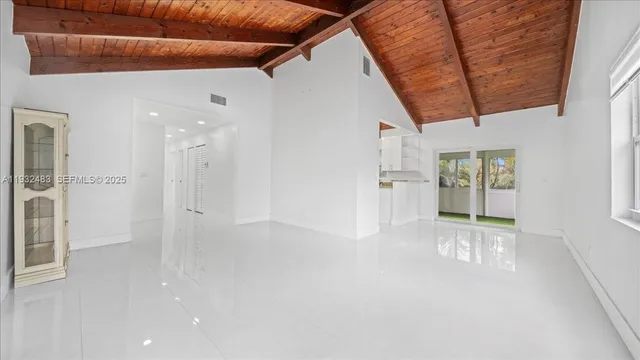 a view of empty room with windows